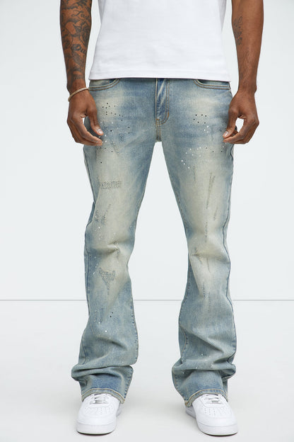 Ripped And Bleach Splatter Stacked Slim Flare Jeans - Light Blue Wash - image 1